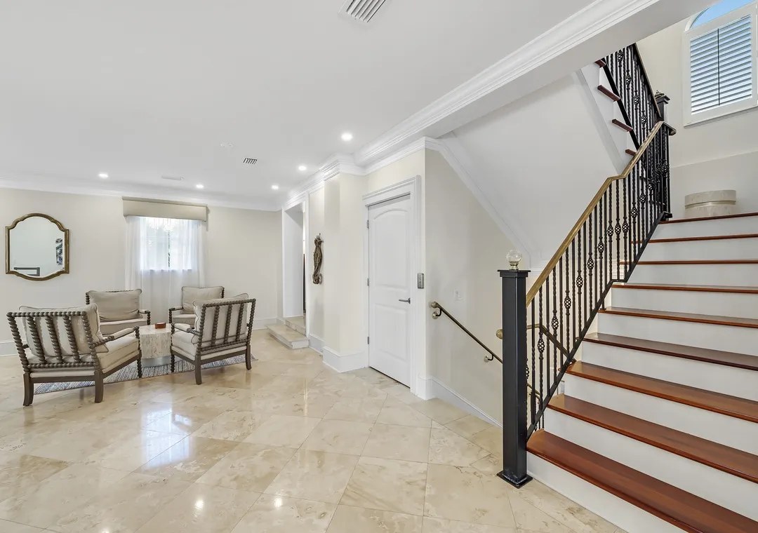 Bright interior entryway and staircase at Bella Villa